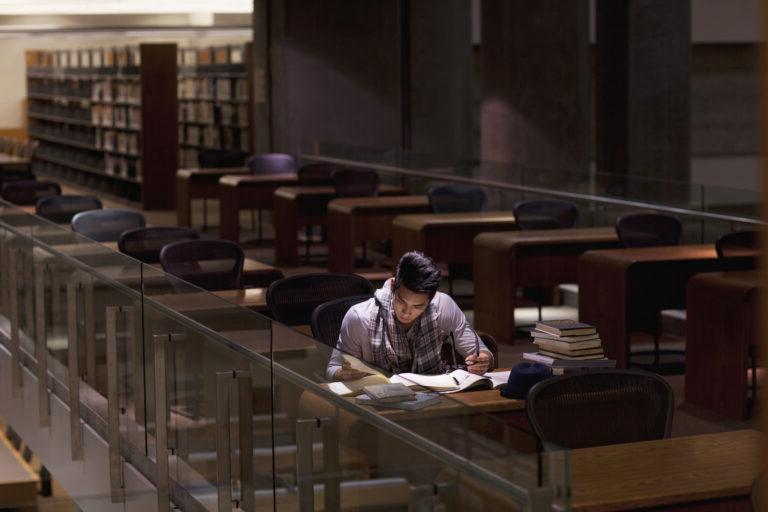 Student working in library at night